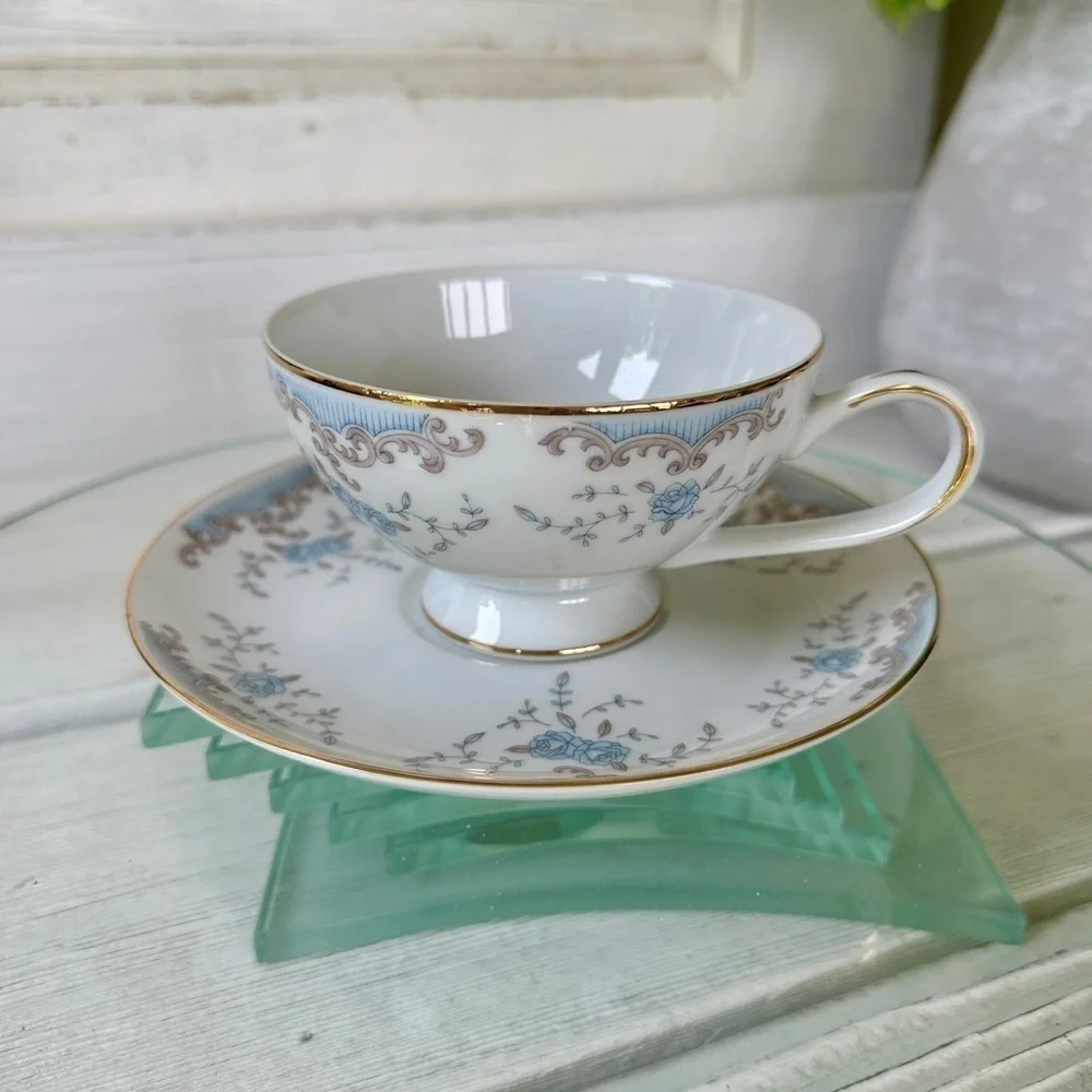 IMPERIAL SEVILLE CHINA CUP & SAUCER. WHITE WITH BLUE FLORAL DESIGN & GOLD TRIM.